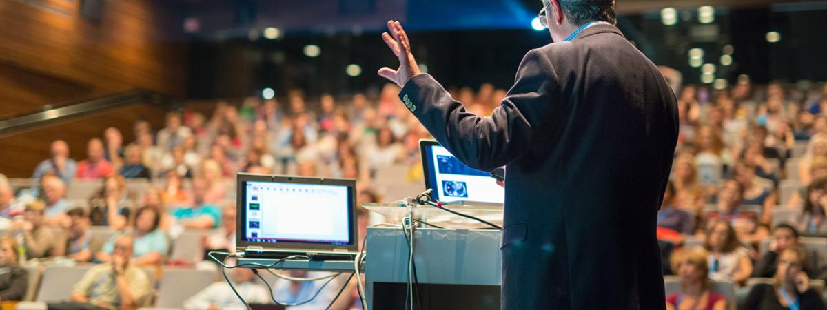 Man speaking at conference